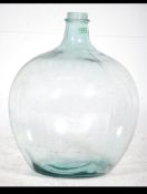 A vintage 20th century large bluish green glass carbouy of bulbous form.
