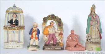 A collection of Staffordshire flatback ceramic figurines to include Spurgeon, The Sailors Return,