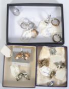 A collection of vintage clip on earrings set with rhinestones together with a collection of white