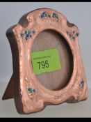 An Art Nouveau style copper and enamel set easel back picture frame. . Weight 85.