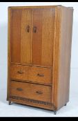 A 1930's Art Deco oak tallboy chest of drawers / linen cupboard having double door linen cupboard