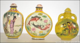 A collection of 3 ceramic and decorative Chinese famille rose perfume - snuff bottles,