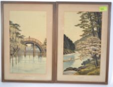 A pair of believed early 20th century Japanese needlepoint silk panels being framed and glazed.