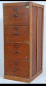 A mid 20th century Air Ministry four drawer oak panelled office filing cabinet.