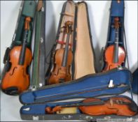 A mixed lot of 4 violins being cased and in various conditions with accessories in some cases .