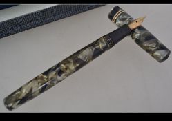 A vintage Swan lever fill fountain pen with 14ct gold nib together with a boxed 1950's Parker