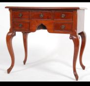 A Georgian style mahogany lowboy desk.