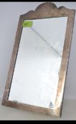 A silver hallmarked tall easel mirror having swag and urn chase decoration.