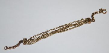 A 9ct gold and yellow metal box link three string bracelet.