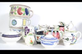 A large collection of Bristol pottery jugs of various forms and designs along with three Bristol