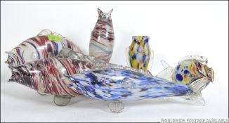 A collection of seven Murano retro glass fish of varying designs and shapes. Measures: 25cms high.