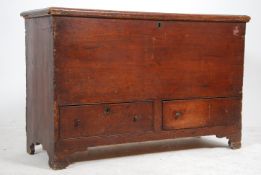 A 19th century country pine mule chest coffer having panelled body with twin lower drawers.