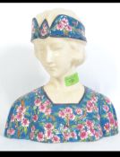 A ceramic bust of an Art Deco style lady in the Longwy style, marked to the base.
