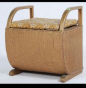 A vintage 20th century Art Deco styled Lloyd Loom laundry basket.