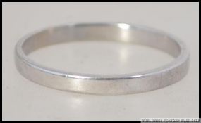 A 9ct white gold ladies band ring being hallmarked to the interior shank.