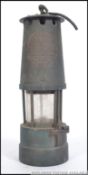 A vintage mid century miners lamp - tilley lamp A1 marked to the front for The Protective Lamp &