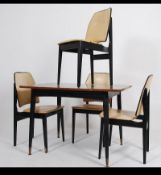 A set of four vintage 20th century G-Plan inspired dining chairs with ebonised frames vinyl seat