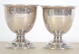 A pair of silver hallmarked egg cups. Birmingham hallmarks for Broadway and Co 1965.