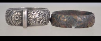 A Victorian silver buckle band ring with foliate decoration. Hallmarked Birmingham 1890. Maker P.B.