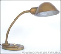 An early 20th Century industrial goose neck desk lamp.