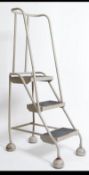 A stunning retro / vintage industrial mid 20th century metal tubular Library / factory ladder.