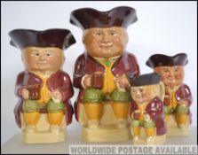 A group of four mid 20th century graduating toby jugs. Each stamped to the base Woods and Sons.