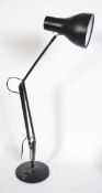 A vintage 20th century black anglepoise Herbert Terry style industrial lamp on circular base.