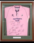 A large framed glazed and mounted Middlesex Cricket Club 20 / 20 signed shirt from 2007.