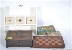 A collection of items to include cigarette cards, carved jewellery box, wall hanging tidy,