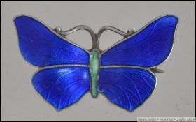 A Sterling silver and enamel Art Nouveau ladies brooch in the form of a butterfly.