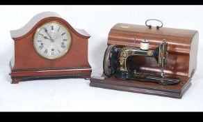 An early 20th century napoleons hat mantel clock with the dial marked for Wales & McCulloch,
