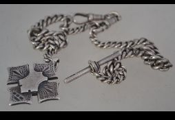 A silver watch fob chain with a fob medal attached .