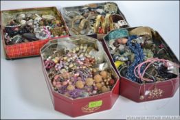 A collection of assorted costume jewellery held within 4 boxes to include bracelets, bangles,