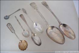 A collection of silver spoons, some hallmarked others to include berry spoons, dessert,