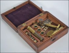 An early 20th century brass 2 drawer telescope together with a Victorian boxed brass miniature