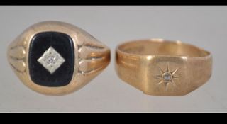 A hallmarked 9ct gold and diamond signet ring set with single diamond in a star cut setting.