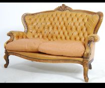 A 20th century rococo leather French sofa canape.
