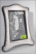 An Edwardian silver hallmarked photograph frame of good size and shape being hallmarked for