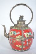 A Chinese ceramic and white metal embellished teapot.