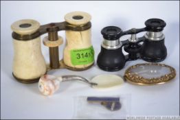 Two pairs of early to mid 20th century opera glasses one pair of bone and brass construction along