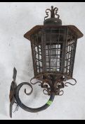A fantastic 19th century Victorian cast metal outside light complete with the original wall bracket