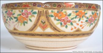 A 19th century good Japanese Satsuma ware fruit bowl with central vignette of Geisha's with gilded