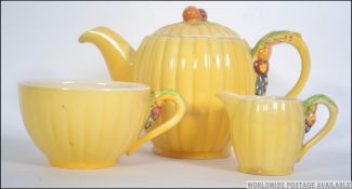 A 1930's Art Deco Brentleigh Ware teapot together with a matching creamer and sugar bowl.