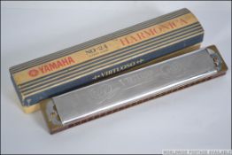 A vintage cased 20th century Yamaha Virtuoso Nippon Gakki No 24 harmonica,