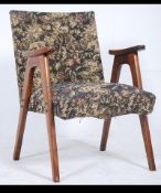 A Stunning vintage retro mid 20th century armchair with superb floating open frame arms.