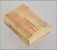 A 19th century Ivory vesta case with hinged lid, the case in the form of a book.