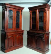 A pair of Victorian style mahogany library bookcase cabinets.