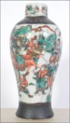 A late 19th early 20th century Chinese crackle glaze vase of medium form with scenes of warriors