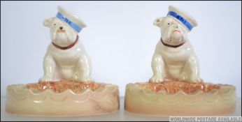 A near pair of rare 1930's Beswick HMS Bulldog ashtrays.
