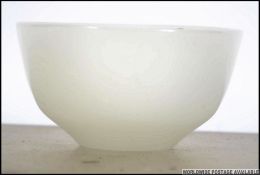 An unusual Chinese 20th century white jade carved bowl. Of translucent form. Measures: 8cms wide.